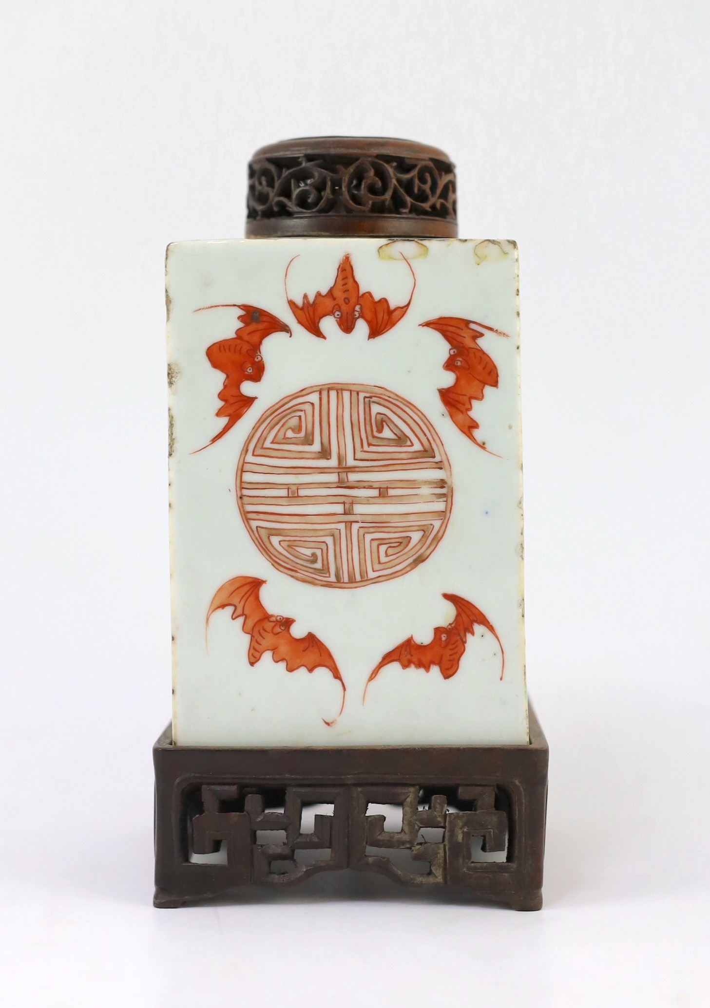 A Chinese famille rose square tea caddy, mid 19th century, 13.7cm high excluding wood stand and cover, slight damage